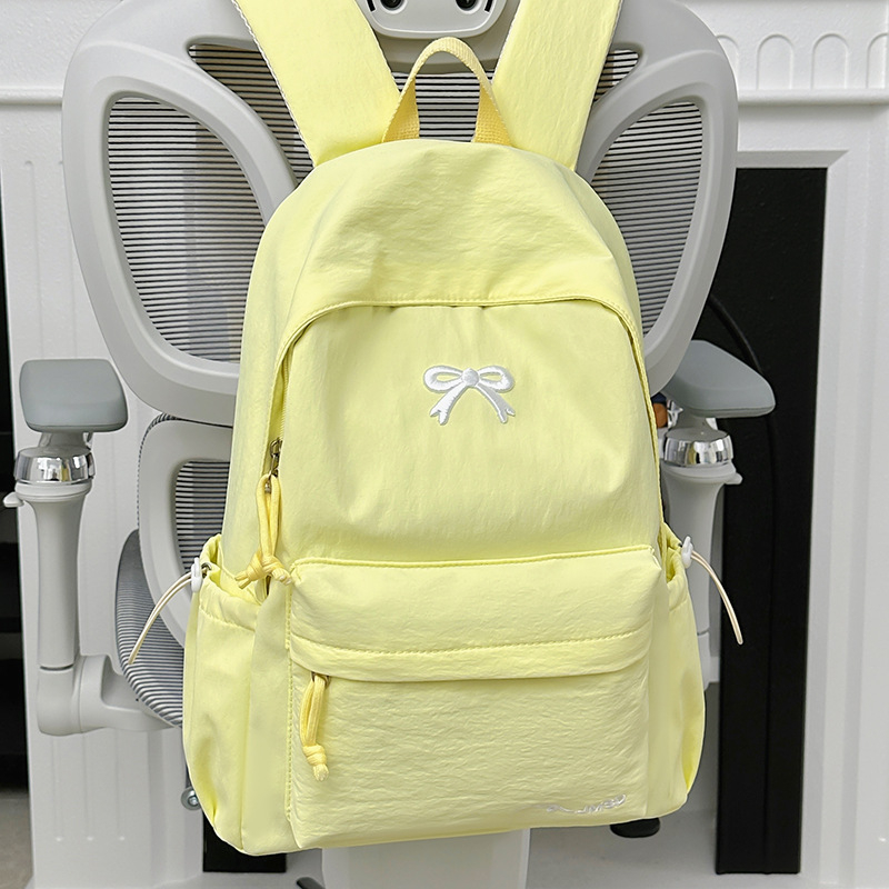 Női masnis hátizsák - nylon, kapacitás 20 L alatt, illeszkedik 10 hüvelykes laptophoz, görbült vállpántok, városi minimalista stílus