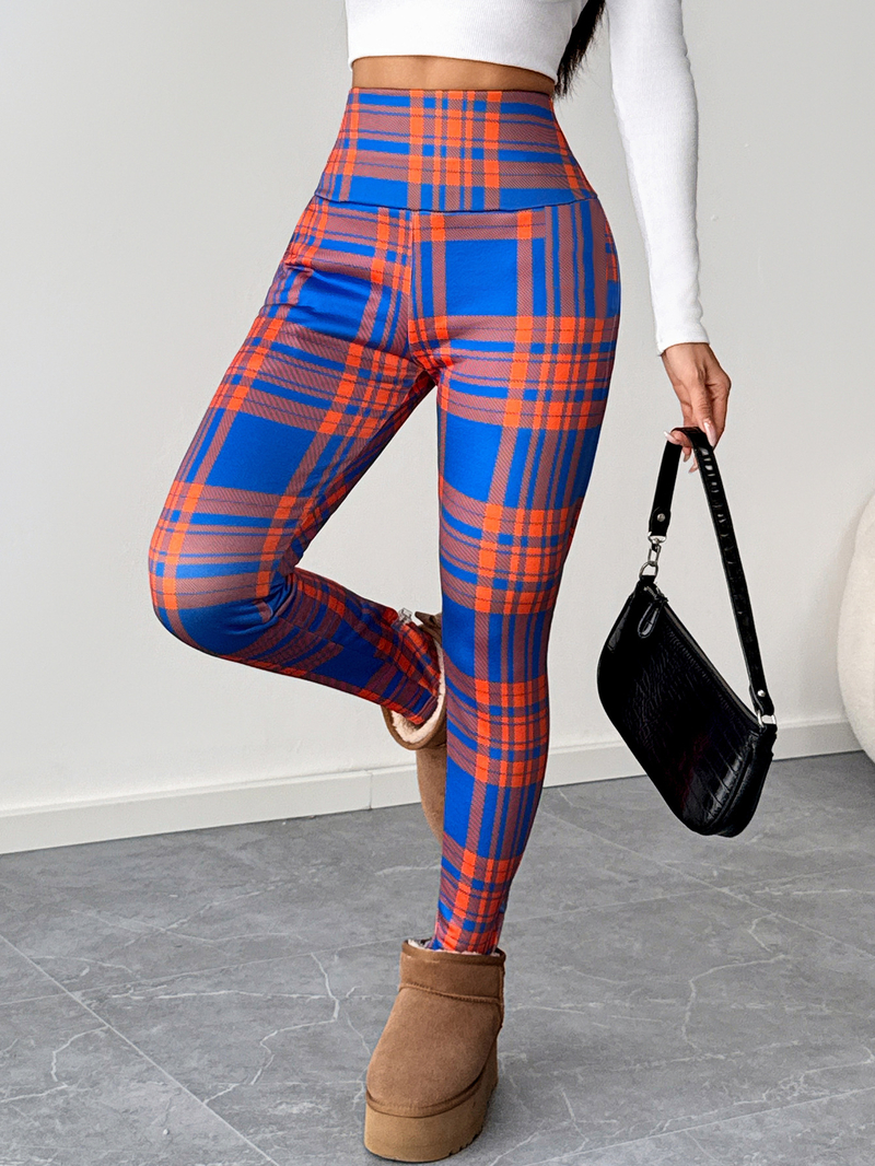 2025 m. ryškiaspalvės, languotos, ėriuko vilnos, aukšto juosmens moteriškos tamprės, priglundančios ir šiltos, tinkamos dėvėti viršutinius drabužius.