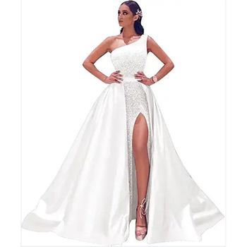 Večernja haljina bez naramenica, s prorezom i otvorenim leđima; tkanina: poliester s elastanom i regenerirana vlakna celuloze; batik postupak