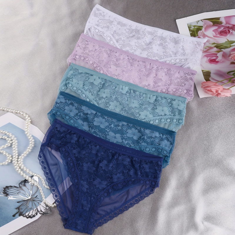 Sieviešu mežģīnē biksītes ar vidukļa vidējo līmeni, ziedu raksts, neilona audums, ķermeņa formēšana, kokvilnas odere starp kājām