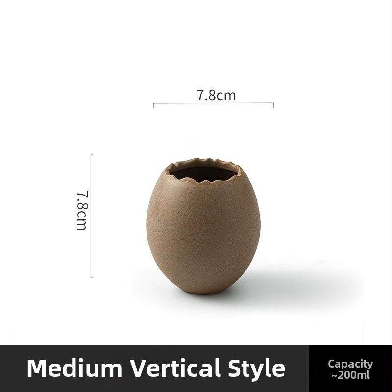 Portselanist magustoidu kauss strutsi kujundusega muna kujul, mikrolaineahi ei toimi