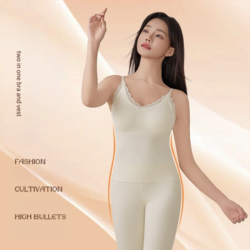 Šilta moteriška vientisa besiūlė apatinė liemenė su krūtinės įdėklu. Rudens ir žiemos lengvi, push-up stiliaus, ploni apatiniai marškinėliai.