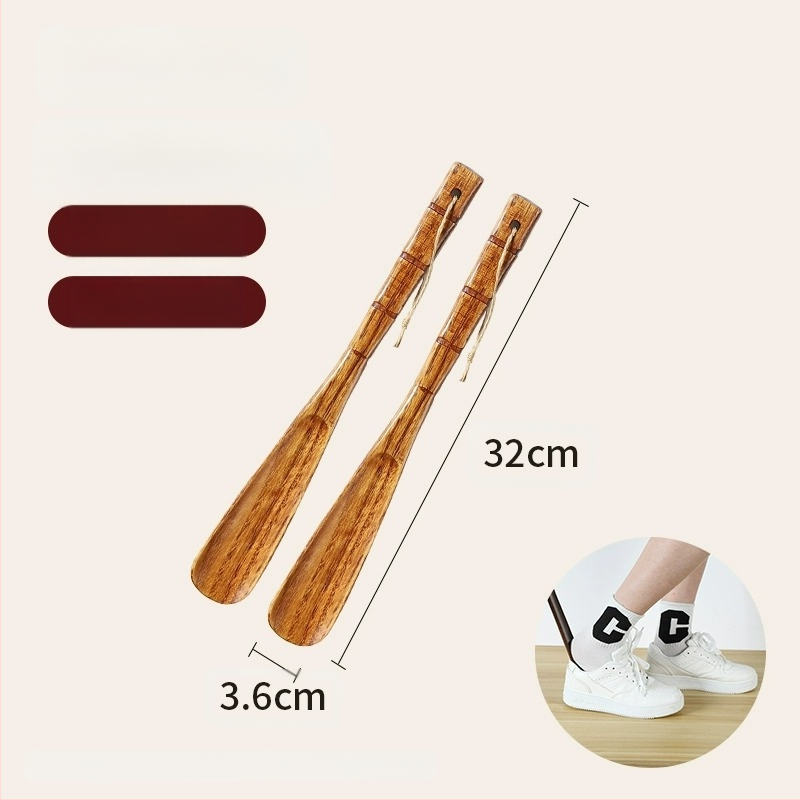 Täispuidust kingatõmmits majapidamises, pika käepidemega, eakad rasedad naised, mitte painutatud kingatõmmits, kulunud kinga artefakt, puidust kingatõmmits, säästab aega