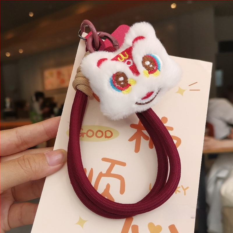 2025 m. prabangios nuotaikos Naujųjų metų raudonas mobiliojo telefono virvelis, mielas pliušinis liūto lėlės pakabukas ant riešo, trumpas