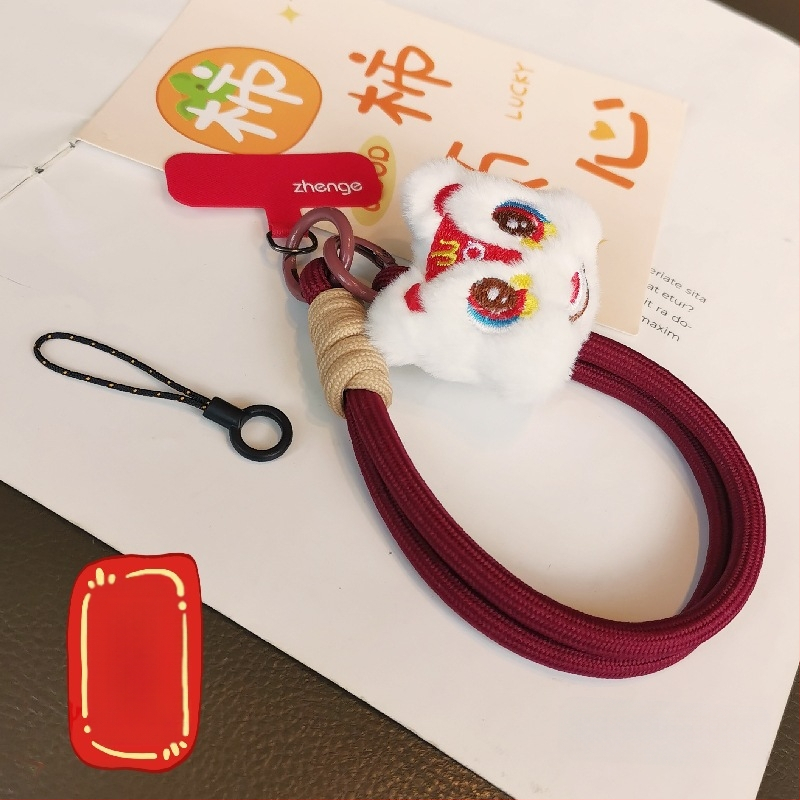2025 m. prabangios nuotaikos Naujųjų metų raudonas mobiliojo telefono virvelis, mielas pliušinis liūto lėlės pakabukas ant riešo, trumpas