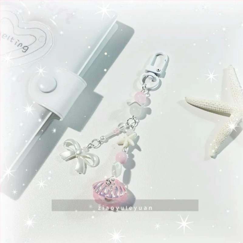 [Zilā gliemežvāka] Ar rokām darināta pērlīšu piekariņa ar zilu jūras leģendu, vēja atslēgu piekariņa soma, kameras ķēdīte