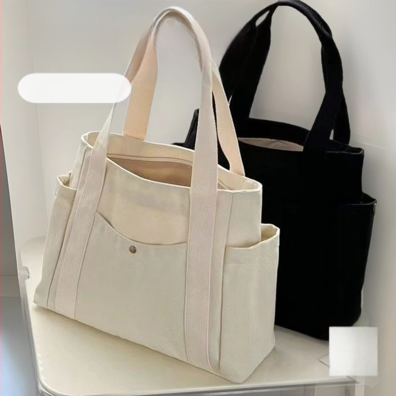 2024. aasta uus lõuendikott, naiste universaalne õlakott, suure mahutavusega raamatutega täidetud õpilase klassiruumi pendeldajakott, uus käekott