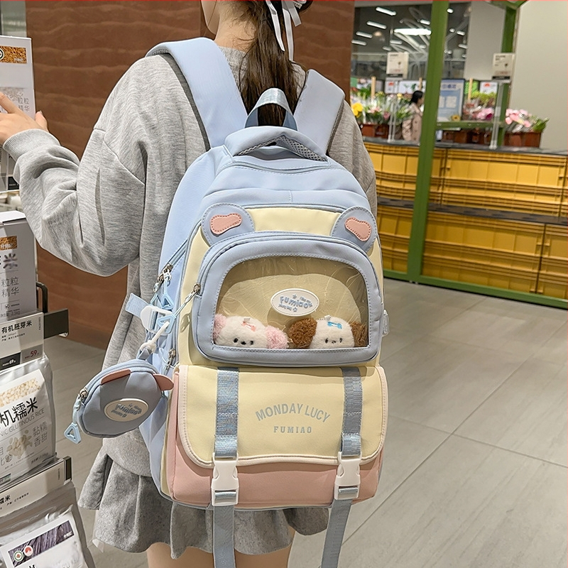Jauna multfilmu stila bērnu mugursoma, maza, svaiga, jauka, lielas ietilpības skolēnu plecu soma, kas paredzēta došanās uz nodarbībām un skolēnu somu