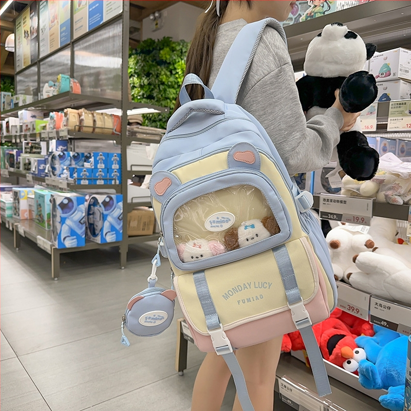 Jauna multfilmu stila bērnu mugursoma, maza, svaiga, jauka, lielas ietilpības skolēnu plecu soma, kas paredzēta došanās uz nodarbībām un skolēnu somu