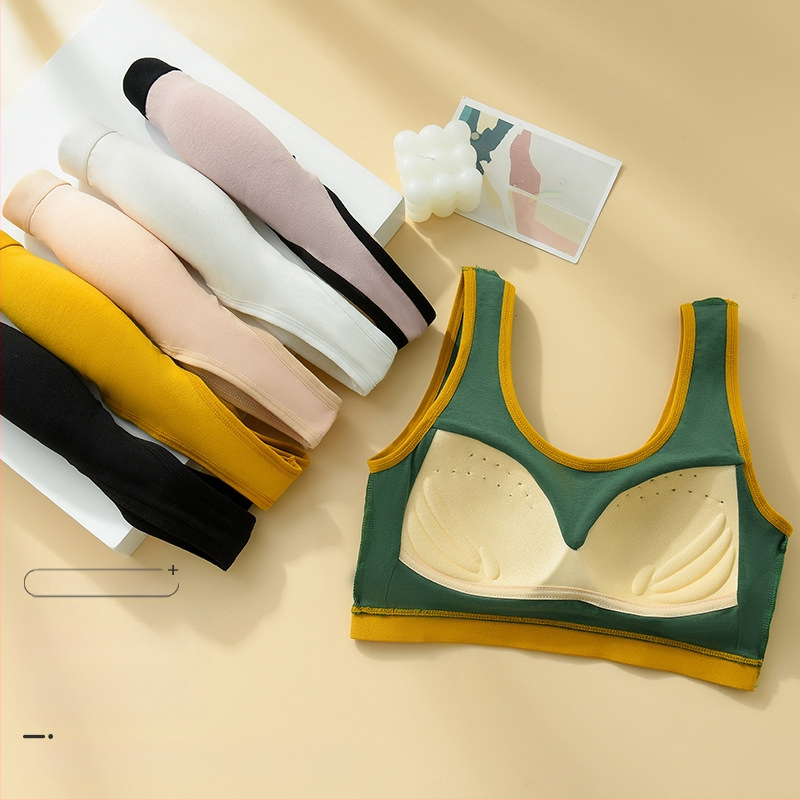 Vienos dalies fiksuoto kaušelio formos liemenėlė be plieninio žiedo, graži nugaros apačia, sportiniai apatiniai su plačia petnešėle, apvynioti krūtinės vamzdeliu, viršutiniai apatiniai