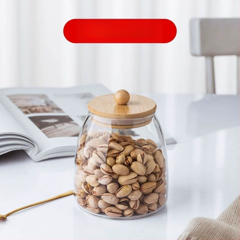 Skaidrus stiklinis arbatos indelis, kvapnus arbatos indelis, juodos arbatos buteliukas, apvalus bambukinis dangtelis su sandarinimo žiedu, prieskonių laikymo indelis