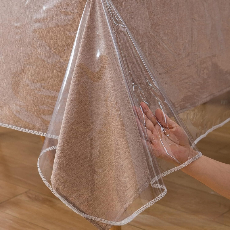 Läbipaistev plastlaudlina 100% veekindel kristallselge läbipaistev lauakaitsekate 0,13 mm lukuga servaga laudlina