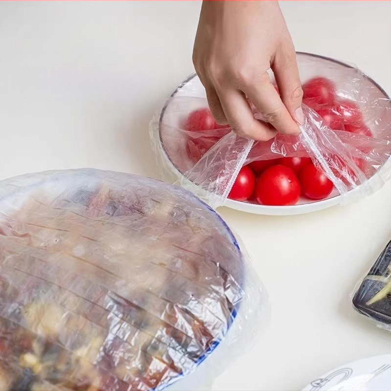 Plastikinė plėvelė, apsauganti nuo musių, vienkartinis buitinio šaldytuvo maisto likučių šviežumą išsaugantis dangtelis, universali plastikinė plėvelė, dubenėlio dangtelis, dubenėlio dangtelis