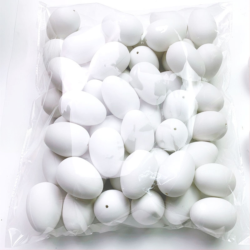 50 tükki valgeid värvilisi kunstmune, plastmassist munakoored, lasteaia käsitööna valminud graffiti lihavõttemunad