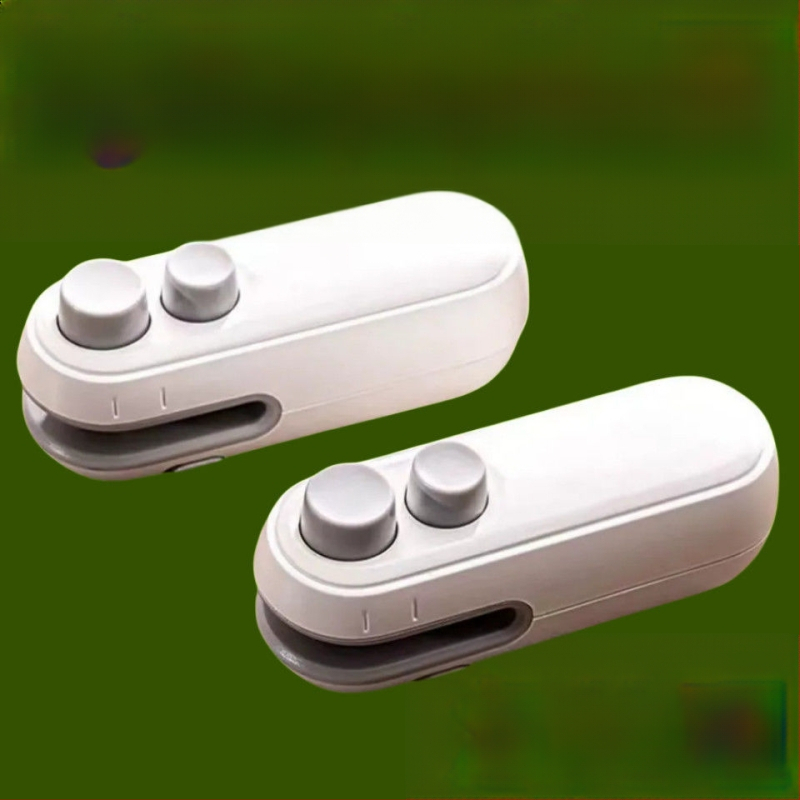 Japonijos sandarinimo mašina, naujas mažas nešiojamas užkandžių artefaktas, buitinis magnetinis siurbimo rankinis slėgis, plastikinis maišelis, sandarinantis stipriai