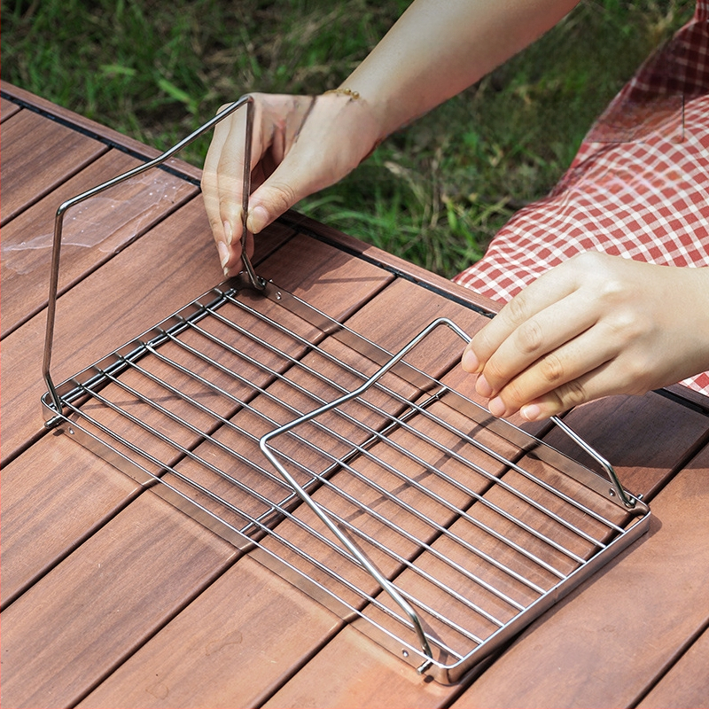Kokkupandav koomiksipliit, grilliriiul, telkimisahi, tee keetmine, majapidamises kasutatav siseruumides kasutatav söegrill, grillipliit