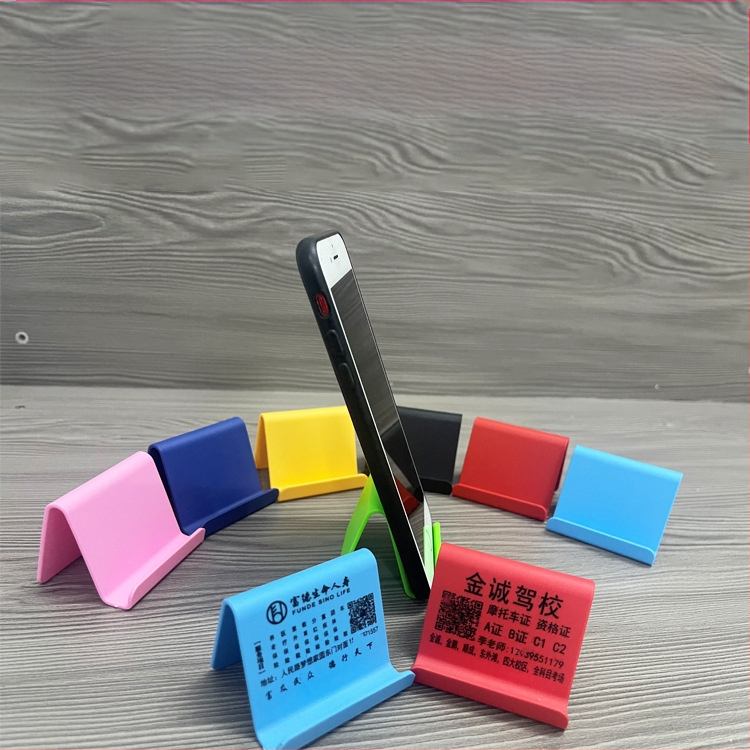 „Ditui“ dovanų reklaminis mobiliojo telefono laikiklis su spausdintu logotipu ir tekstu. Paprastas nešiojamas stalinis mobiliojo telefono laikiklis, didmeninė prekyba.