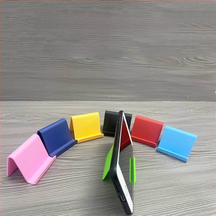 „Ditui“ dovanų reklaminis mobiliojo telefono laikiklis su spausdintu logotipu ir tekstu. Paprastas nešiojamas stalinis mobiliojo telefono laikiklis, didmeninė prekyba.