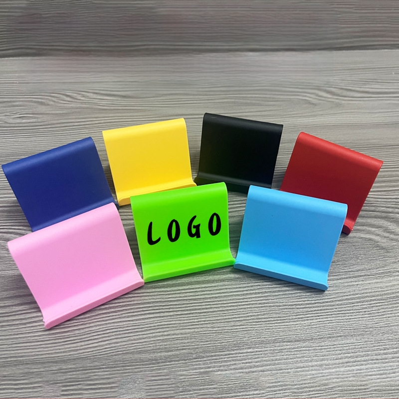 „Ditui“ dovanų reklaminis mobiliojo telefono laikiklis su spausdintu logotipu ir tekstu. Paprastas nešiojamas stalinis mobiliojo telefono laikiklis, didmeninė prekyba.