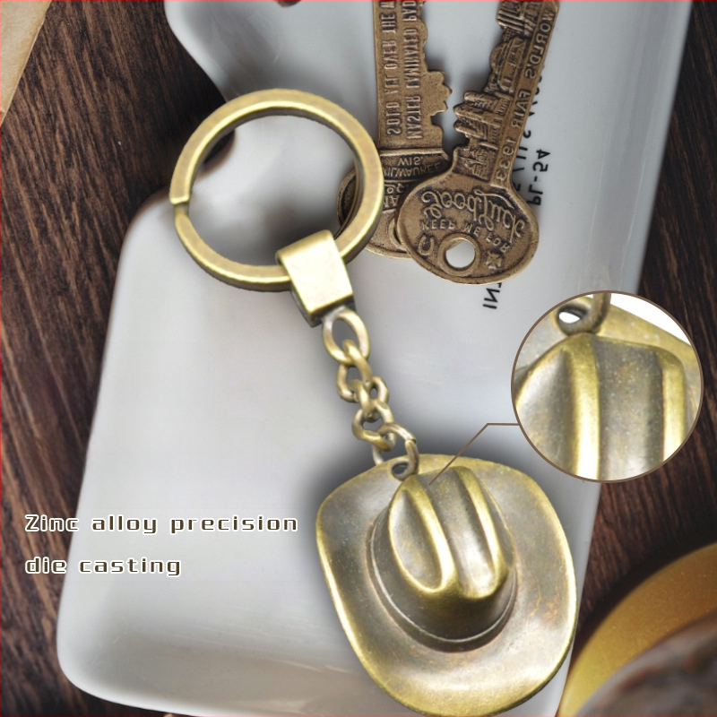 Nauji raktų pakabukų aksesuarai, kaubojaus skrybėlės pakabukas, kūrybinga dovana, „Amazon“ tarpvalstybinis karšto metalo raktų pakabukas