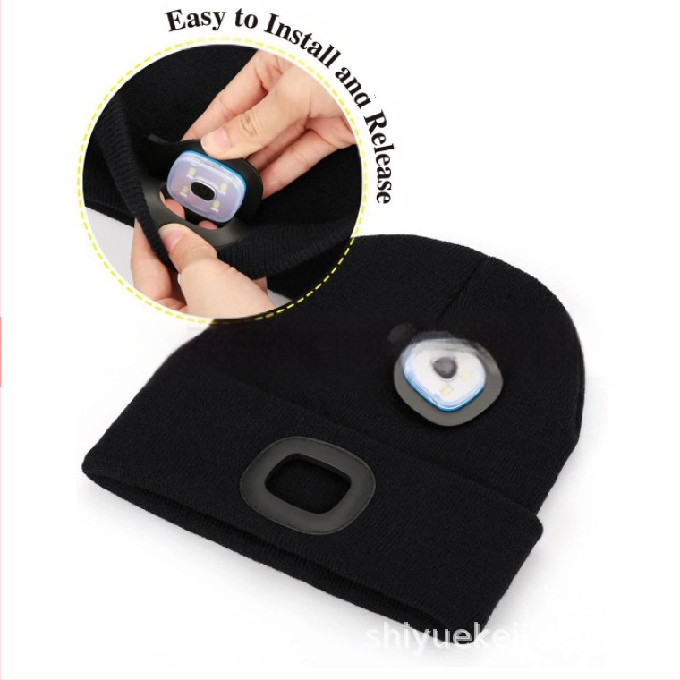 Šviesą skleidžianti šilta megzta kepurė su europietiška ir amerikietiška LED lempute, apšviečianti kepurę.