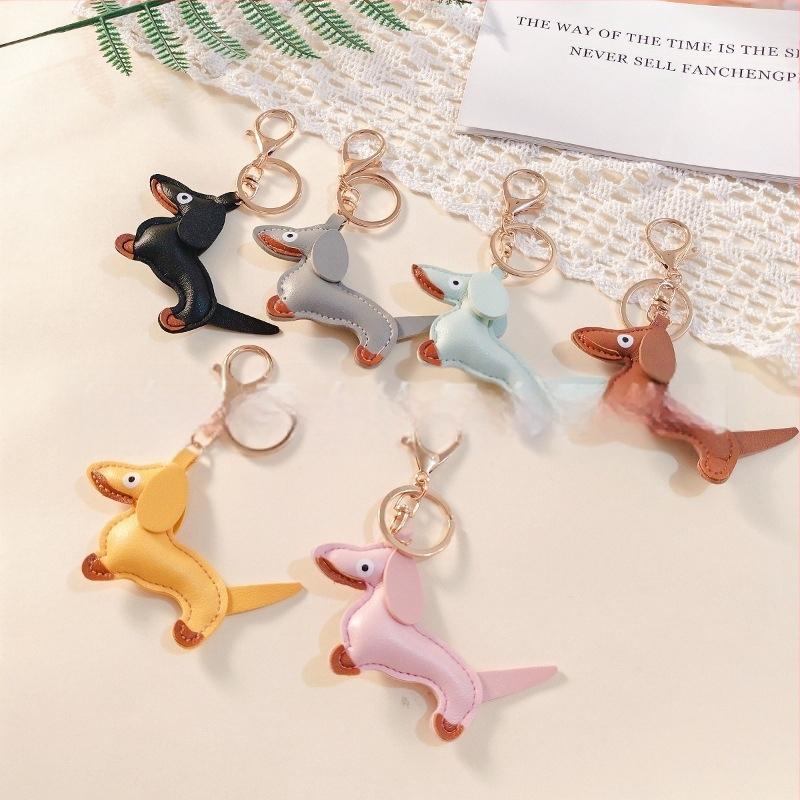 Határokon átnyúló Amazon új PU tacskó kutya kulcstartó kézi kötél táska függő baba kézitáska dekoratív bőr medál Tide