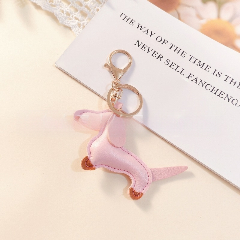 Határokon átnyúló Amazon új PU tacskó kutya kulcstartó kézi kötél táska függő baba kézitáska dekoratív bőr medál Tide