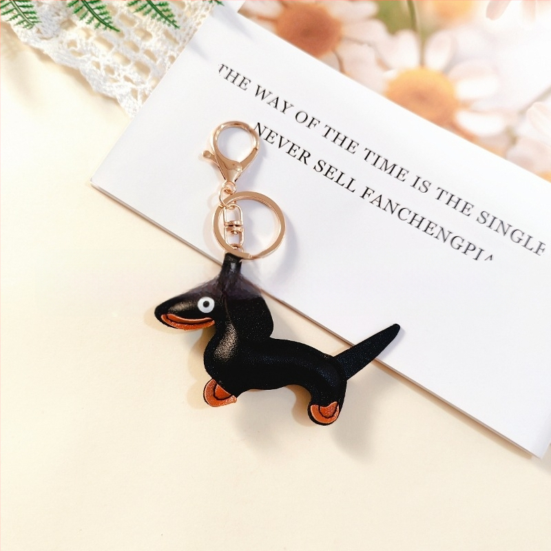 Határokon átnyúló Amazon új PU tacskó kutya kulcstartó kézi kötél táska függő baba kézitáska dekoratív bőr medál Tide