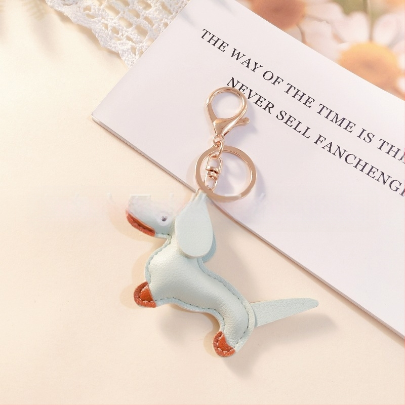 Határokon átnyúló Amazon új PU tacskó kutya kulcstartó kézi kötél táska függő baba kézitáska dekoratív bőr medál Tide