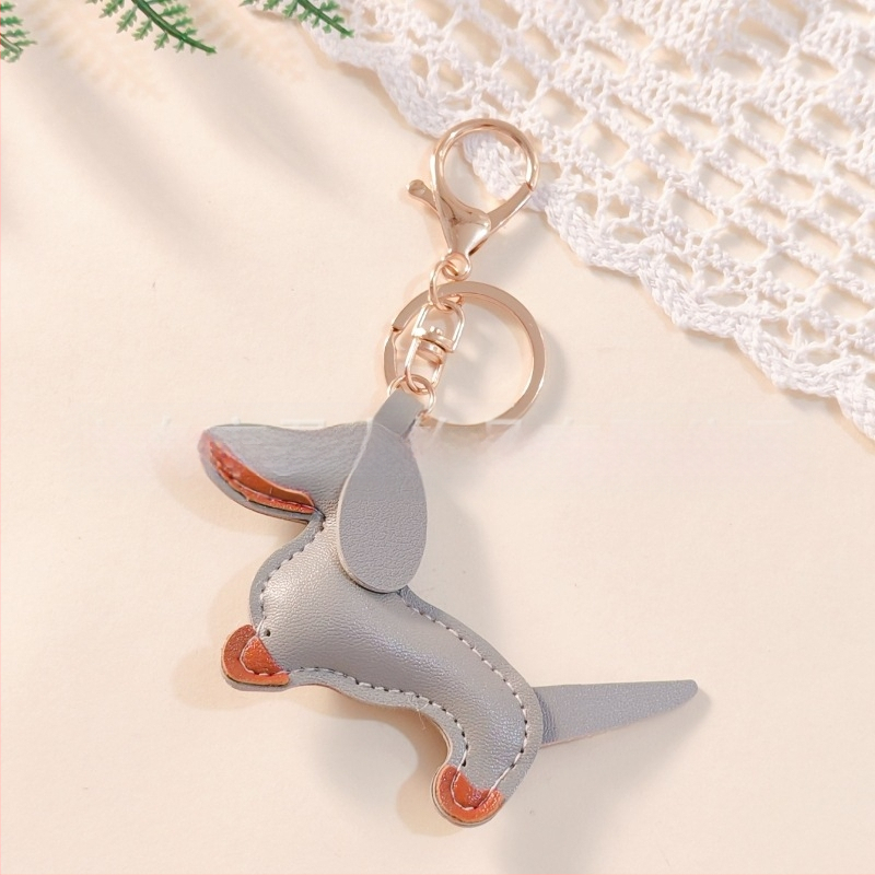 Határokon átnyúló Amazon új PU tacskó kutya kulcstartó kézi kötél táska függő baba kézitáska dekoratív bőr medál Tide