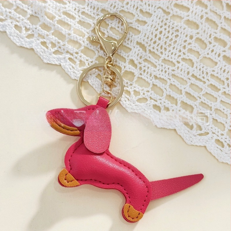 Határokon átnyúló Amazon új PU tacskó kutya kulcstartó kézi kötél táska függő baba kézitáska dekoratív bőr medál Tide
