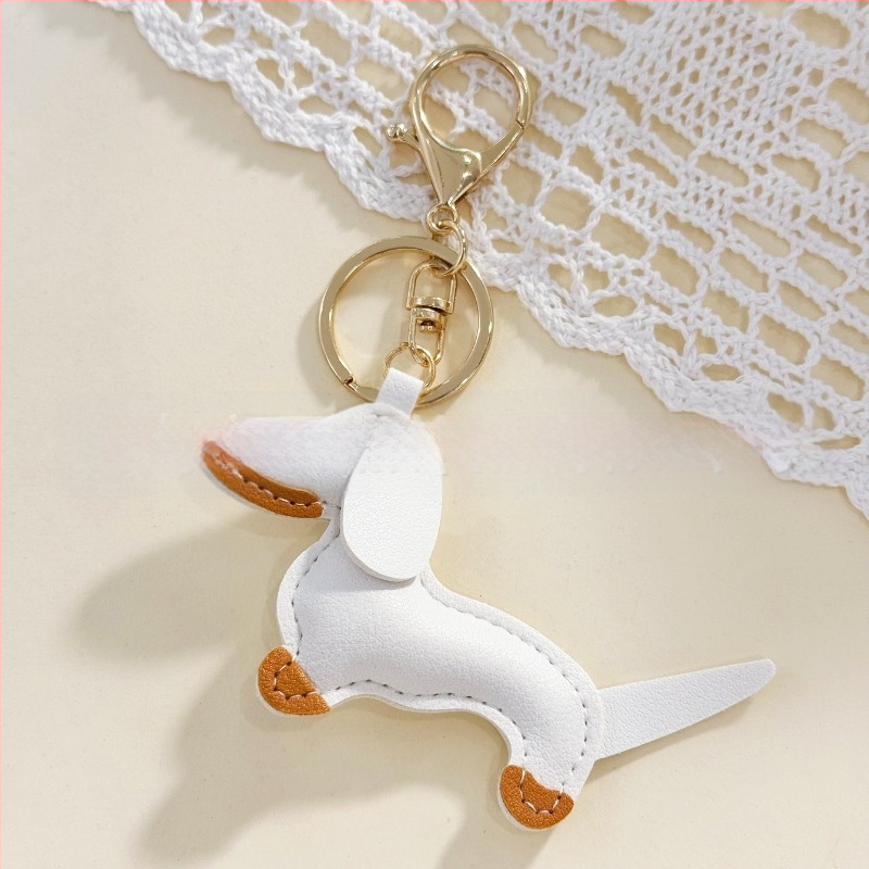 Határokon átnyúló Amazon új PU tacskó kutya kulcstartó kézi kötél táska függő baba kézitáska dekoratív bőr medál Tide