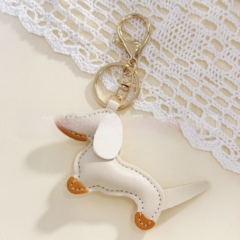 Határokon átnyúló Amazon új PU tacskó kutya kulcstartó kézi kötél táska függő baba kézitáska dekoratív bőr medál Tide