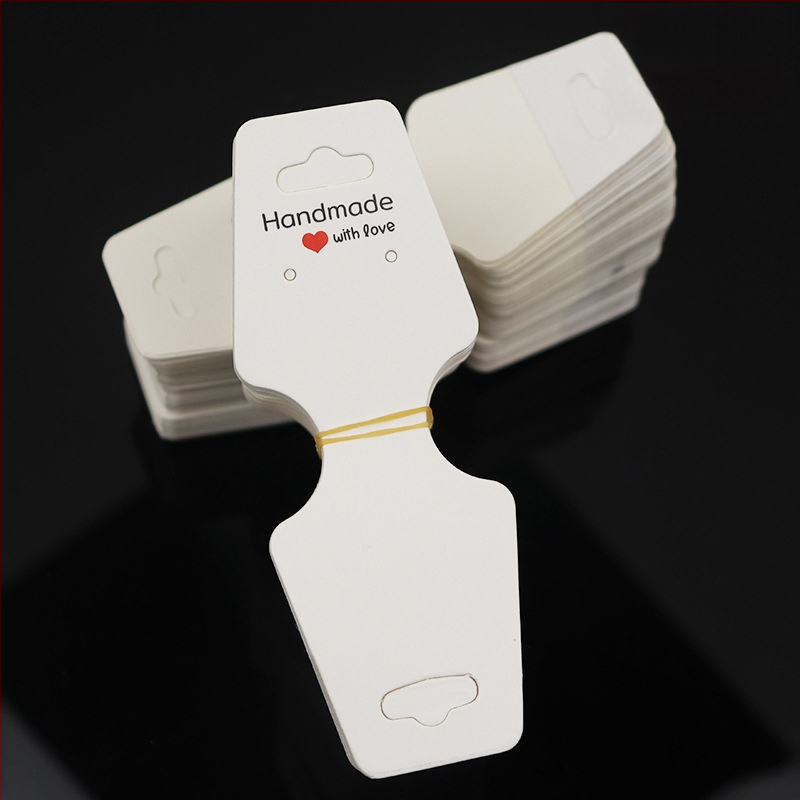 Papuošalų kortelė, perlenkta per pusę su lipnia kortele, lipni „Liftas Love“ rankų darbo papuošalų demonstravimo kortelė, skirta tarpvalstybiniam sprogimui, yra sandėlyje.