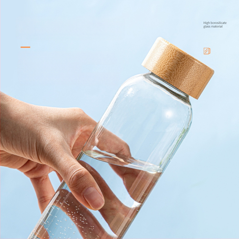 Υψηλής ποιότητας βοριοπυριτικό μπαμπού καπάκι κορδόνι γυάλινο αθλητικό μπουκάλι νερό μονής στρώσης γυάλινο φορητό δημιουργικό ποτήρι ανάπηρου κυλινδρικό ποτήρι νερού