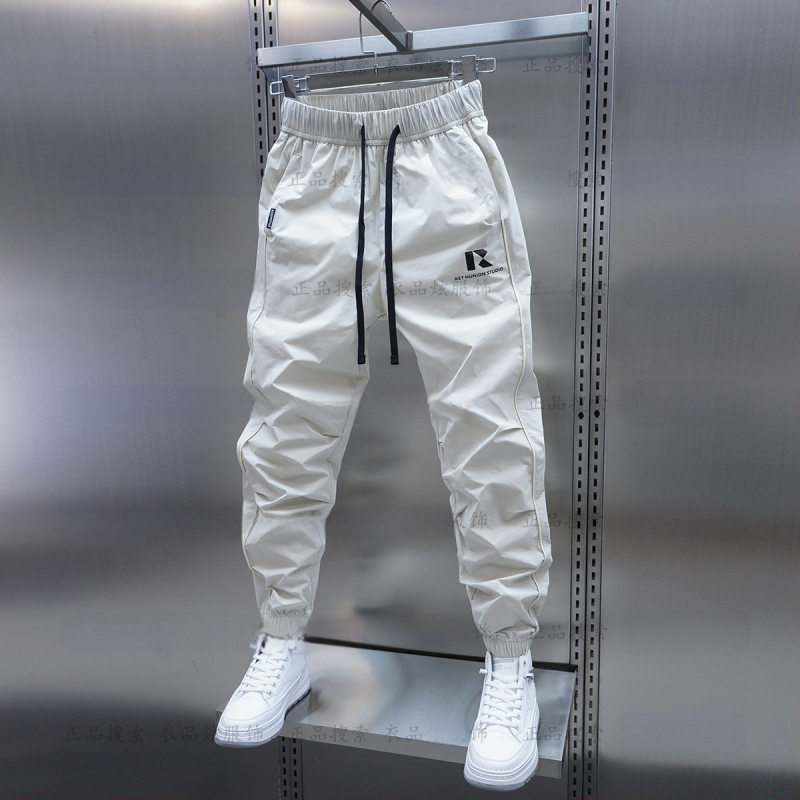 Tavaszi és őszi új férfi lezser nadrág koreai stílusú, gyorsan száradó, laza szárú, divatos, egyszínű, minden lábra illeszkedő nadrág