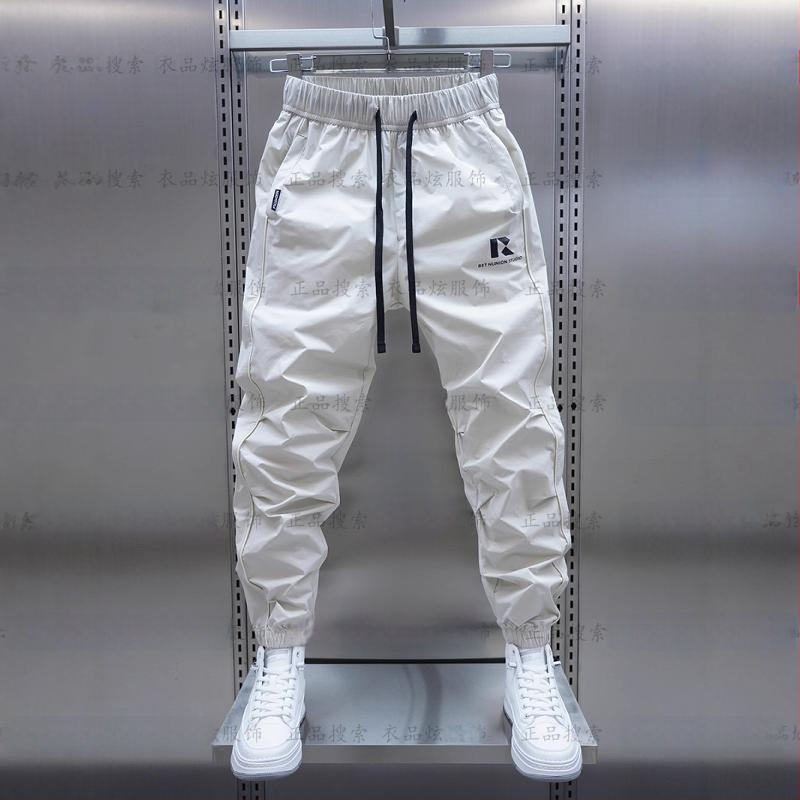 Tavaszi és őszi új férfi lezser nadrág koreai stílusú, gyorsan száradó, laza szárú, divatos, egyszínű, minden lábra illeszkedő nadrág