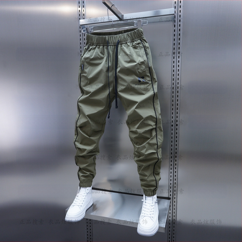 Tavaszi és őszi új férfi lezser nadrág koreai stílusú, gyorsan száradó, laza szárú, divatos, egyszínű, minden lábra illeszkedő nadrág