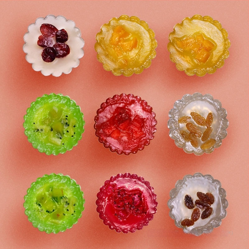 Ühekordselt kasutatav krüsanteemikoogi vorm, ümmargune plekkfooliumist tass, munakoogipuding, hobuserauakujuline koogisupi täidisekott, plekk-paberikauss