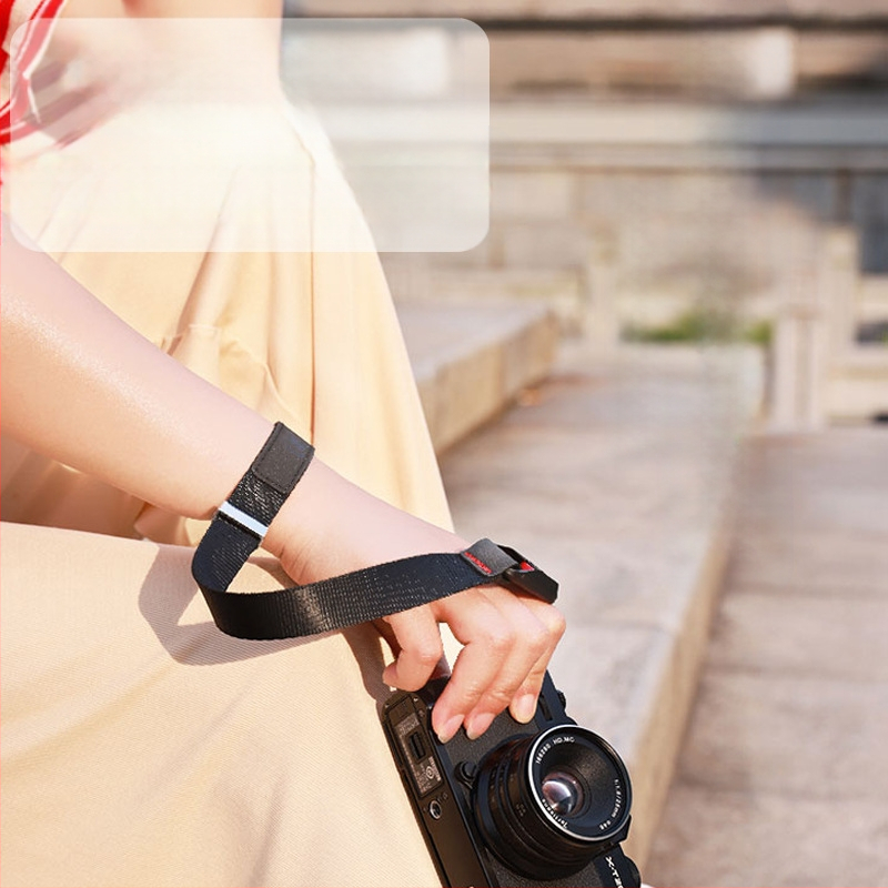 Greito atkabinimo fotoaparato riešo dirželis, skirtas vienai SLR mikro kameros riešo dirželiui, magnetiniam prisisiurbimui ir apsaugai nuo nuėmimo, greitai išardomas vienos rankos riešo dirželis.