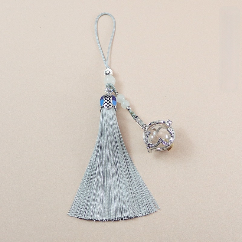 Neljaleheline ristik klaasist kuulikujulise tutiga ripats, mida saab avada, kinaveripudeli ripats, mobiiltelefoni ripats, võtmehoidja ripats, soovipudeli ripats