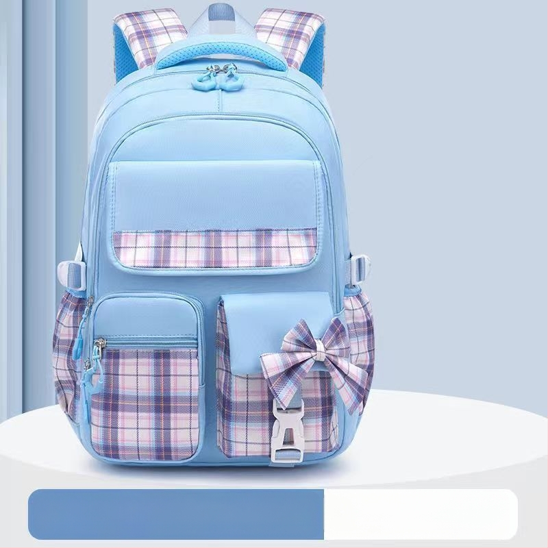 Hulgimüügis olevad algkooliõpilaste koolikotid, naismudelid, armas koomiksiga lips, suure mahutavusega, koormust vähendav seljakott, selgroogu kaitsev laste seljakott