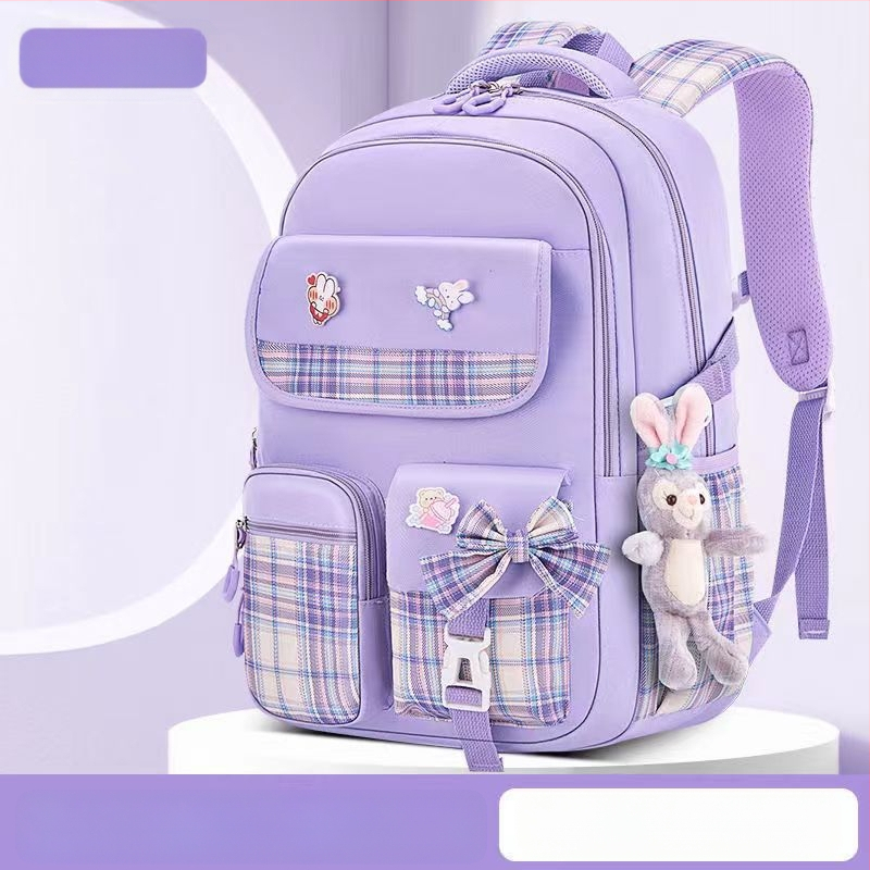 Hulgimüügis olevad algkooliõpilaste koolikotid, naismudelid, armas koomiksiga lips, suure mahutavusega, koormust vähendav seljakott, selgroogu kaitsev laste seljakott