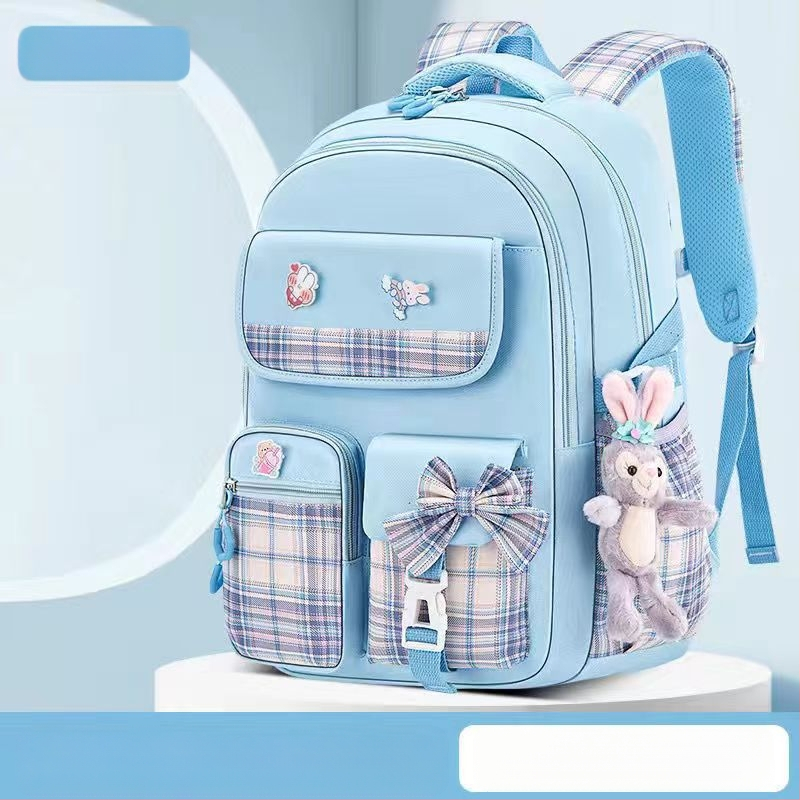 Hulgimüügis olevad algkooliõpilaste koolikotid, naismudelid, armas koomiksiga lips, suure mahutavusega, koormust vähendav seljakott, selgroogu kaitsev laste seljakott