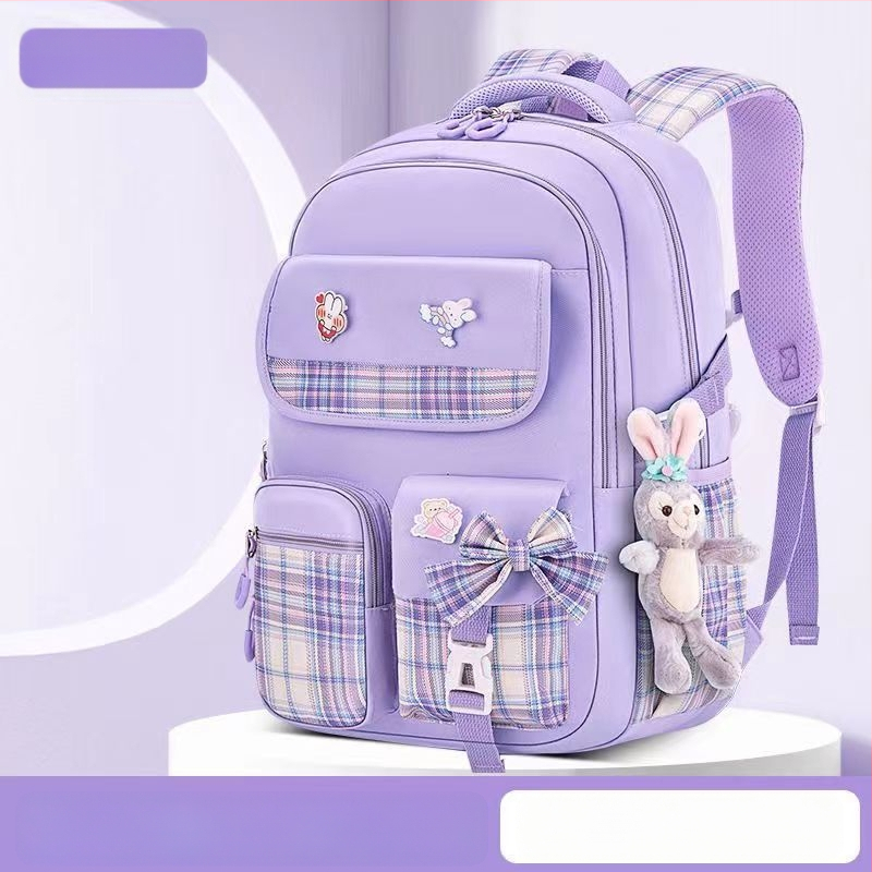 Hulgimüügis olevad algkooliõpilaste koolikotid, naismudelid, armas koomiksiga lips, suure mahutavusega, koormust vähendav seljakott, selgroogu kaitsev laste seljakott