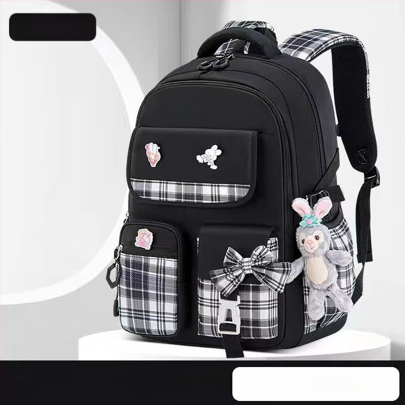 Hulgimüügis olevad algkooliõpilaste koolikotid, naismudelid, armas koomiksiga lips, suure mahutavusega, koormust vähendav seljakott, selgroogu kaitsev laste seljakott