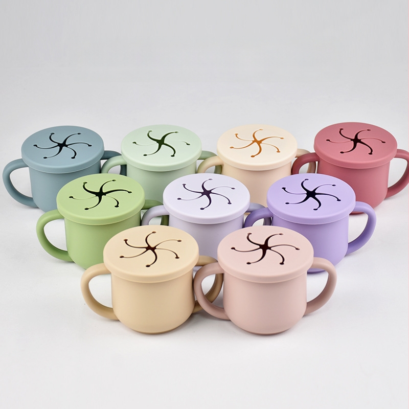 Karšto pardavimo vaikiškas silikoninis dvigubos ausies užkandžių puodelis su atidarymu, specialus mokymosi gėrimo puodelis kūdikiams ir mažiems vaikams, motinystės ir kūdikių reikmenys, kūdikio gėrimo puodelis