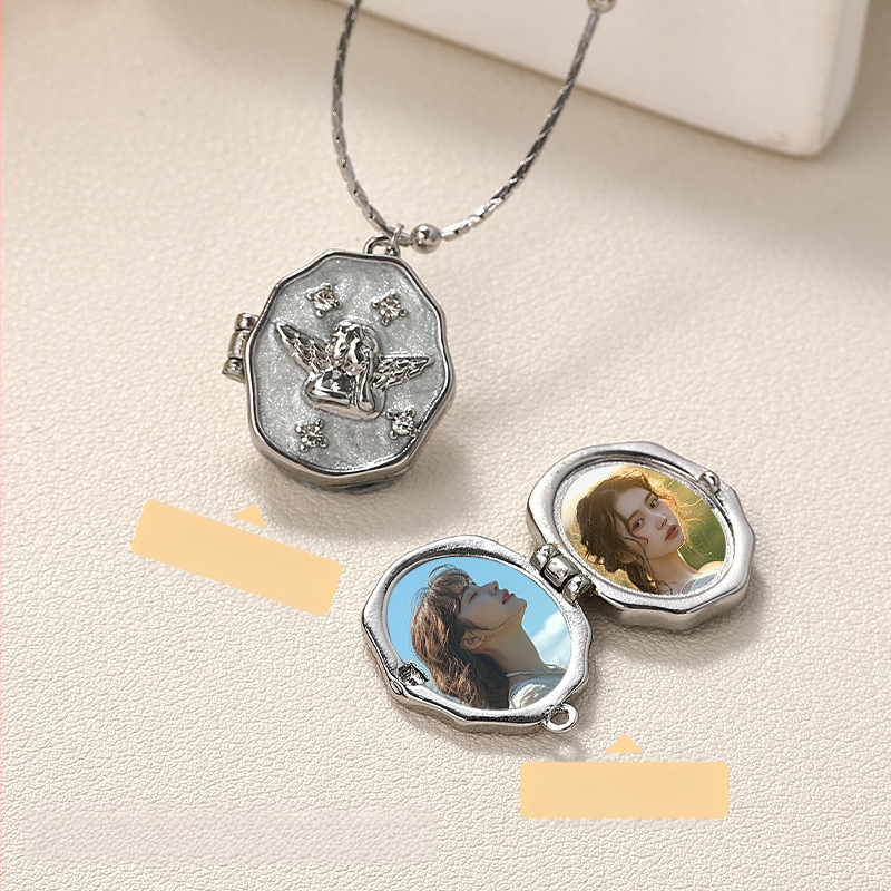 Piiriülene populaarne fotokarbikaelakee, galvaniseeriv värvi säilitav isikupärastatud ingli ripats, kaasaskantav avatav mälestusfotoalbumi kaelakee