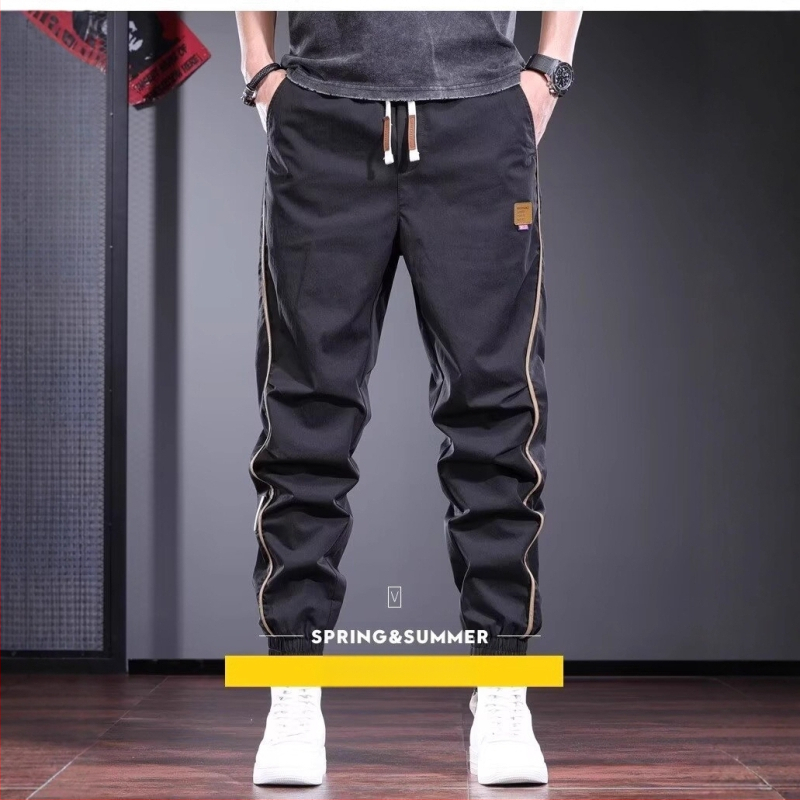 Suvised õhukesed vabaajapüksid meestele. Trendikas brändi niši disainiga spordiretuusid 2025. aasta uued mitmekülgsed mustad meeste püksid.