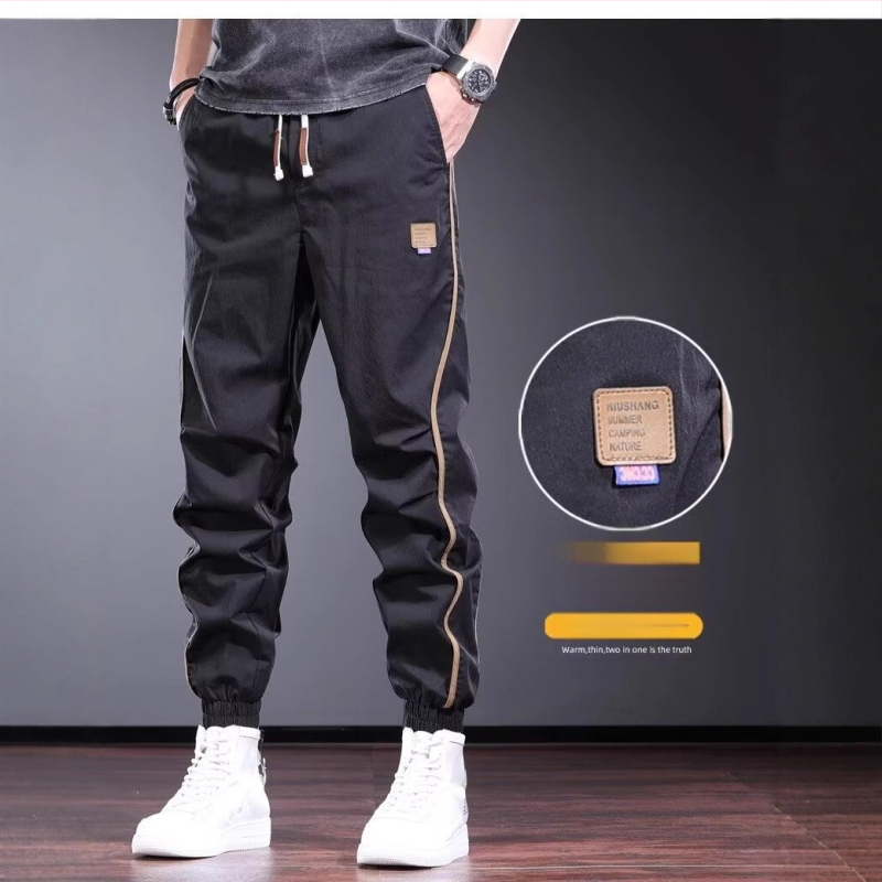 Suvised õhukesed vabaajapüksid meestele. Trendikas brändi niši disainiga spordiretuusid 2025. aasta uued mitmekülgsed mustad meeste püksid.